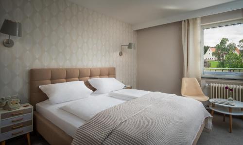 Katil atau katil-katil dalam bilik di Hotel Sonnenhof Teinachtal