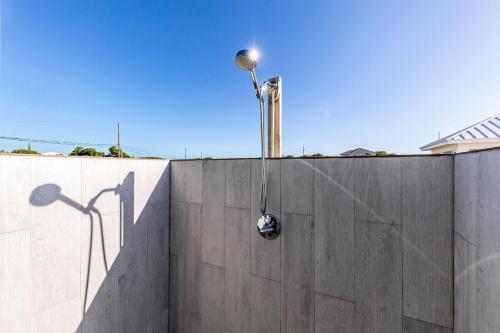 a street light on the side of a wall at NEW Tropical Waterfront Cooper Jack Bay Villas in Five Cays Settlement