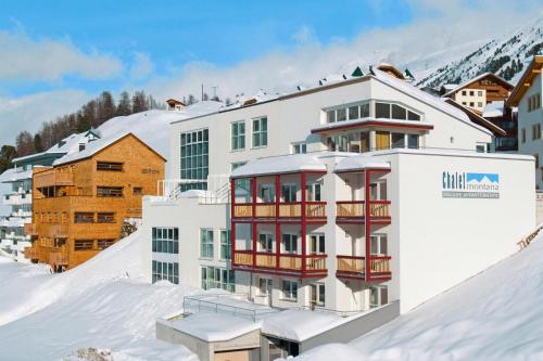 a hotel in the snow with a mountain in the background at Apartment in Obergurgl in the mountains in Obergurgl