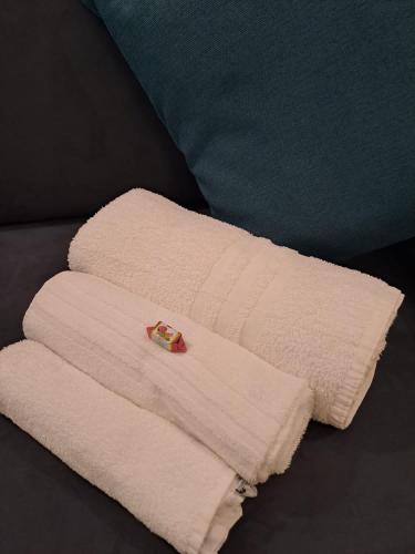 a white towel sitting on top of a bed at La dimora dei Rolli in Genoa