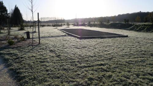a skateboard ramp in the middle of a field at Les Chalets du Moulin de Valade in Condat-sur-Trincou