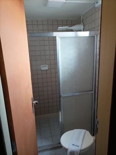 a bathroom with a toilet and a shower stall at Pousada A Pérola in Rio de Contas