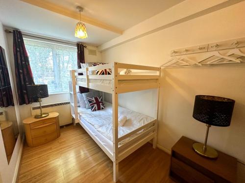 a bunk bed room with two bunk beds in it at 36 O’Leary square in London