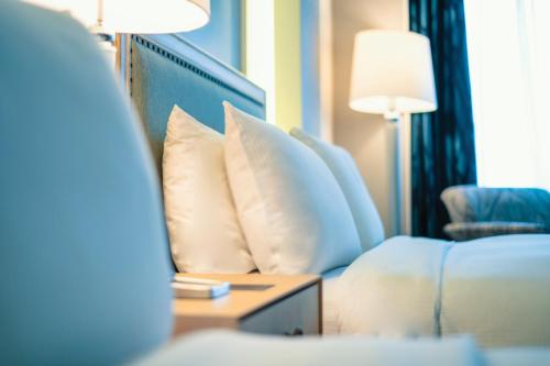 a hotel room with a couch and a table with pillows at Hilton Colon Guayaquil Hotel in Guayaquil