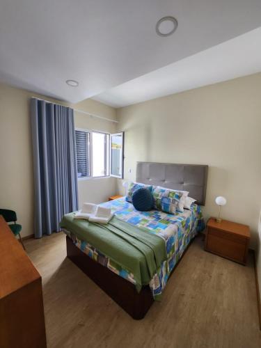 a bedroom with a bed and a window at Blue Horizon, Sea and Mountain view in Estreito da Calheta
