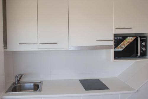 Dapur atau dapur kecil di Happy Tavira Apartments - Apartamento Cabanas Sky no Resort Golden Club Cabanas