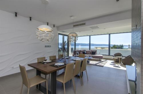 a dining room with a table and chairs at Villa Ivan in Omiš