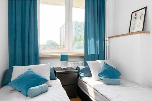 Ένα ή περισσότερα κρεβάτια σε δωμάτιο στο Warsaw Concierge Srebrna