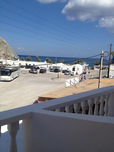 a view from a balcony of a parking lot at Sagma Beach Rooms in Perissa