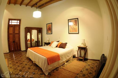 Giường trong phòng chung tại Posada Finca Garciarena