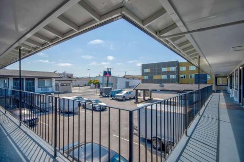 a balcony with a view of a parking lot at Studio 6 Eureka CA Old Town in Eureka