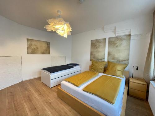 a bedroom with a large bed at 150qm - 5 rooms - free parking - MalliBase Apartments in Hannover