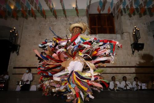 a person in a dress made out of discarded shoes at Quinta Real Oaxaca in Oaxaca City