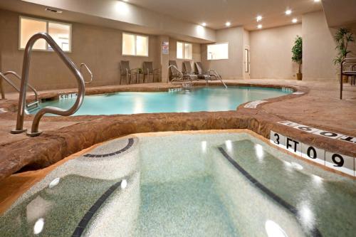 a large indoor pool in a hotel room at Holiday Inn Express Hotel & Suites Cedar Hill by IHG in Cedar Hill