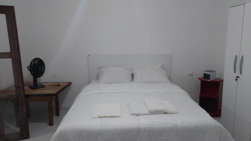 Postel nebo postele na pokoji v ubytování Residencial Maria de Lourdes