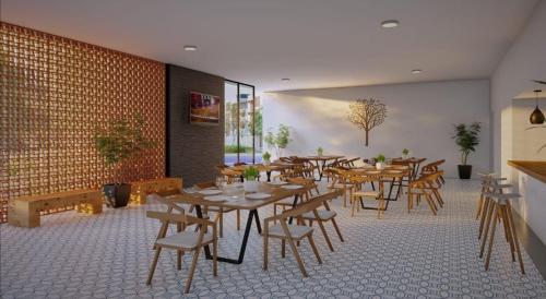 a restaurant with wooden tables and chairs in a room at Condo Temis Vallarta in Puerto Vallarta
