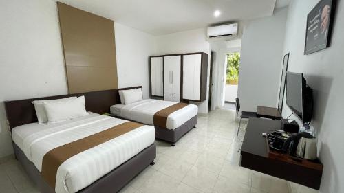 Cama o camas de una habitación en LPP Convention Hotel Demangan