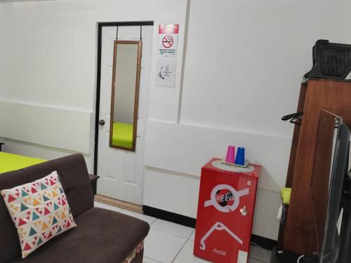 a room with a chair and a door with a mirror at Gran Hotel Desamparados in Desamparados