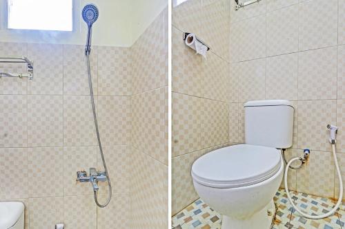 a bathroom with a toilet and a shower at OYO Life 93034 Ayri Home in Salatiga