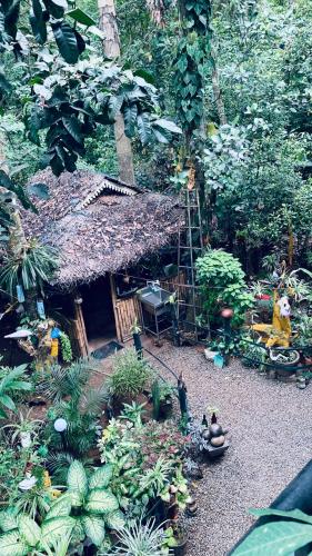 a model of a garden with a house and plants at Jungleview Home Stay in Idukki