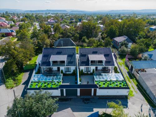 an aerial view of a house with solar panels on the roof at VİP Family Home in Gabala