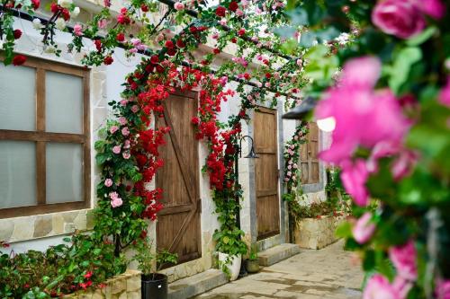 a building with a bunch of flowers on it at De Vivre Homestay Măng Đen in Kon Von Kla