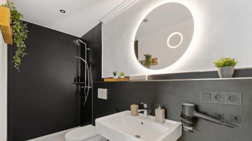 a bathroom with a white sink and a mirror at Punta Cana in Steinberg