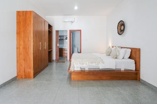 Ένα ή περισσότερα κρεβάτια σε δωμάτιο στο Maisaba Coliving Cempaka