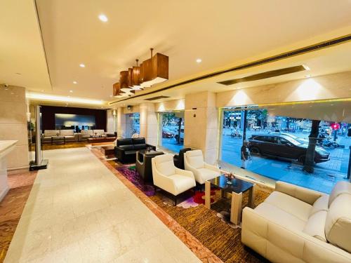 a living room with a car on the wall at Palace Hotel Saigon in Ho Chi Minh City