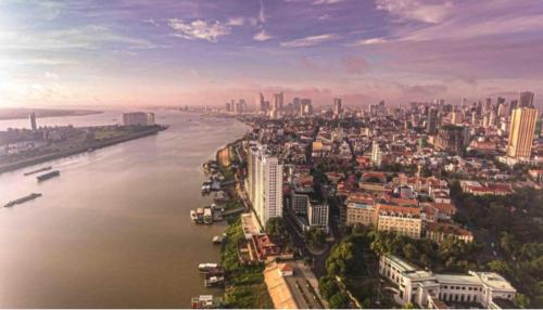 an aerial view of a city next to a river at Somato Hotel in Phnom Penh