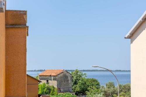 a view of the water from a house at Park Hotel Residence in Orbetello