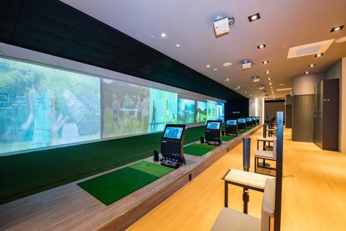 a room with a row of laptop computers on display at Sollago Myeongdong Hotel & Residence in Seoul