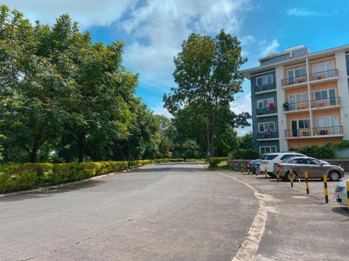 an empty parking lot in front of a building at A nature’s den in Tagaytay in Tagaytay