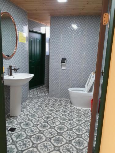 a bathroom with a sink and a toilet at Deluna House in Mokpo