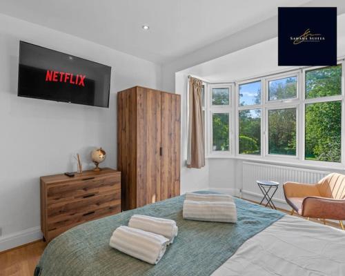 Ένα ή περισσότερα κρεβάτια σε δωμάτιο στο Luxury 6 bed 6 En-suite - Free Parking Reading