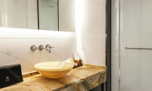 a bathroom with a bowl sink on a counter at Incheon Guwol Hotel Bay 204 in Incheon