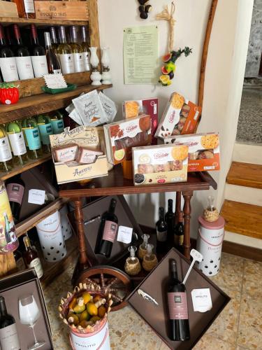 a table filled with lots of bottles of wine at Ficarazzi in Morano Calabro