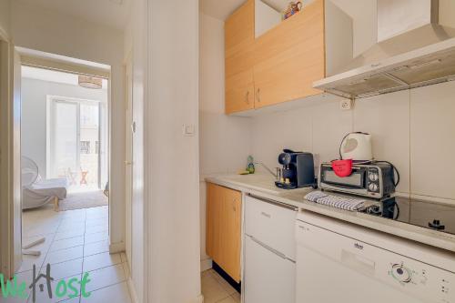 a kitchen with a counter top with a microwave at Charming apartment with Cosy Balcony Old Port in Marseille