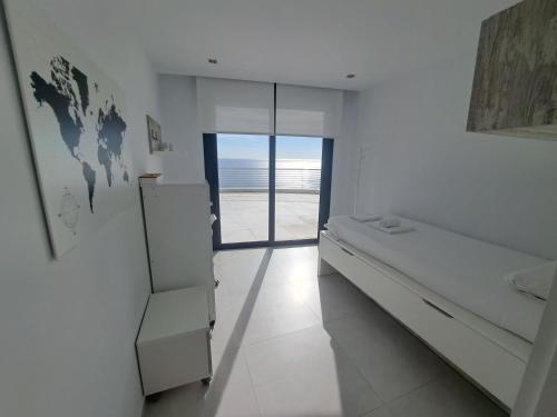 Ένα ή περισσότερα κρεβάτια σε δωμάτιο στο Infinity View by Mar Holidays - Arenales del Sol