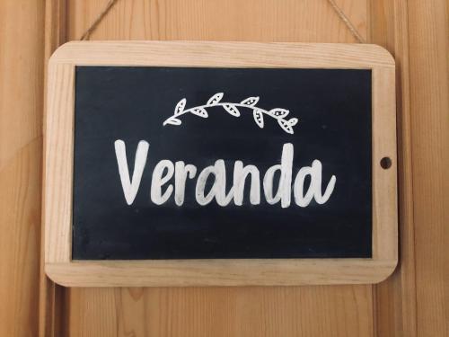 a chalkboard sign that saysendarida hanging on a wall at Chesa-strimer - Veranda in La Punt-Chamues-ch