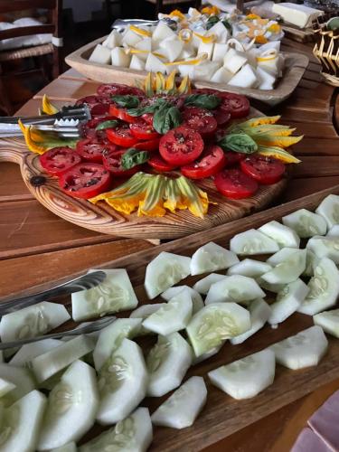 a table topped with plates of vegetables on display at Agriturismo La Locanda Del Parco in Morano Calabro