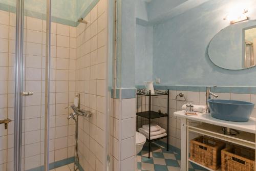 a bathroom with a shower and a toilet and a sink at Eleonas Houses - Kardamili's Acqua Bliss in Kardamyli