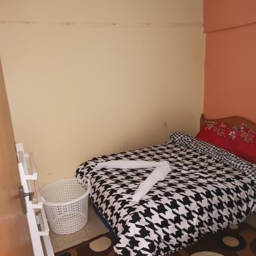 מיטה או מיטות בחדר ב-Bosslady Staycation C1