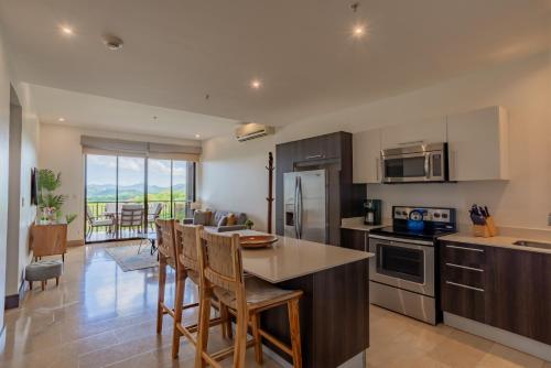 A kitchen or kitchenette at Roble Sabana 404 Luxury Apartment Adults Only - Reserva Conchal