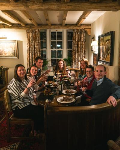 a group of people sitting around a table at The Lion at Malpas in Malpas