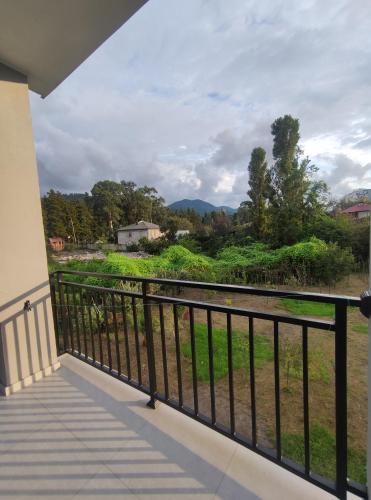 a balcony with a view of a field at The best guest house-GAIOZ in Gonio