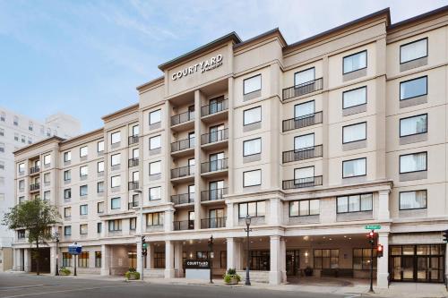 a rendering of the front of the hotel ledger building at Courtyard Milwaukee Downtown in Milwaukee