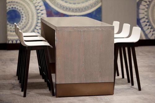 a metal table with two white chairs next to it at San Francisco Marriott Union Square in San Francisco