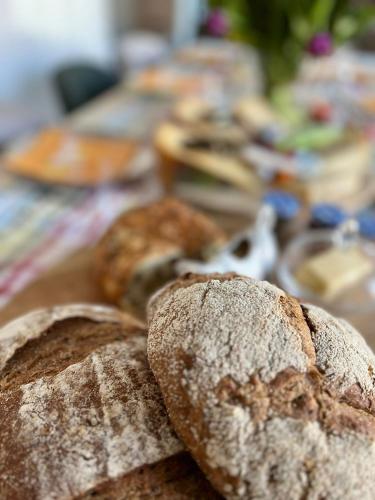 a group of bread sitting on top of a table at La Dominotte Arcen in Arcen