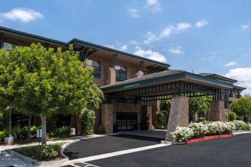 a building with a gate in a parking lot at Hampton Inn & Suites Agoura Hills in Agoura Hills